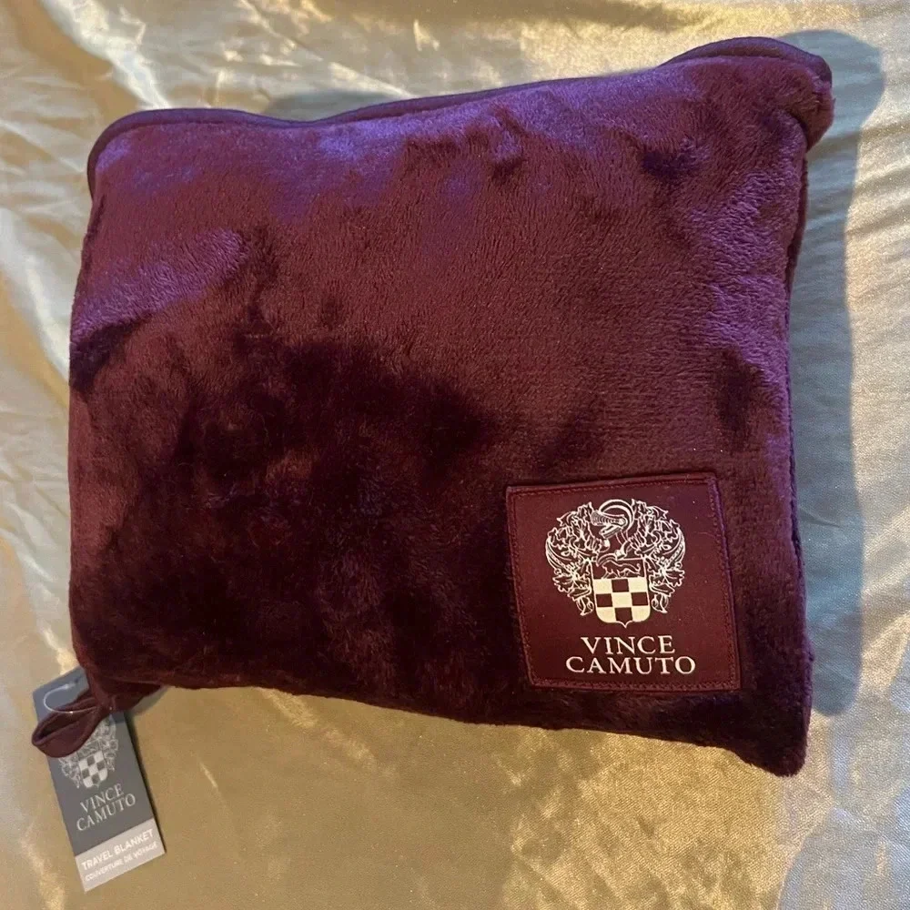 Vince camuto travel blanket with zipper storage bag.